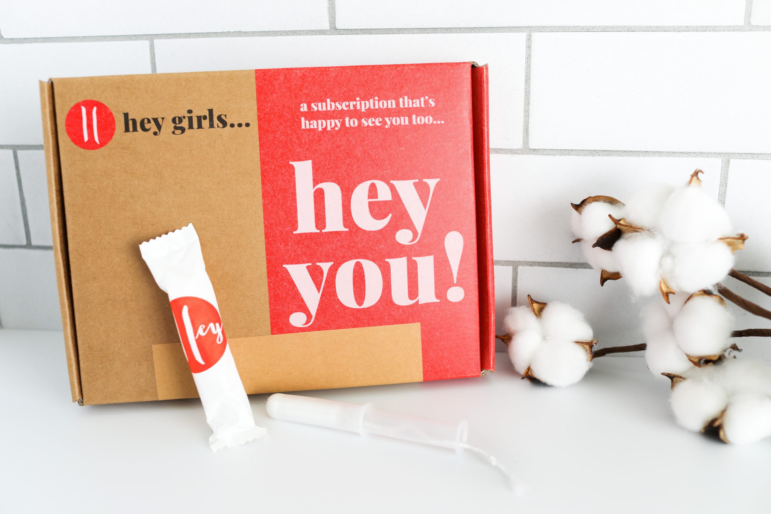 box of plant regular based tampons with a cotton branch beside it