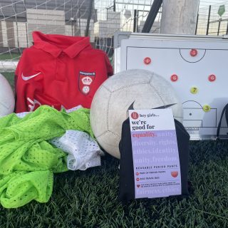 hey girls period pants featured with soccer jerseys and balls in the photo