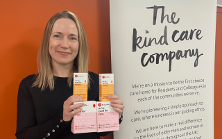 Kate Ward holding Hey Girls products