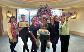 Old Course Hotel, Golf Resort and Spa staff holding Hey Girls products in hotel lobby
