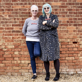Celia (CEO) and Kate against wall